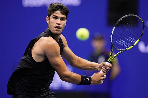 US Open 2024: Carlos Alcaraz returns a shot to Li Tu during the first round of the U.S. Open
